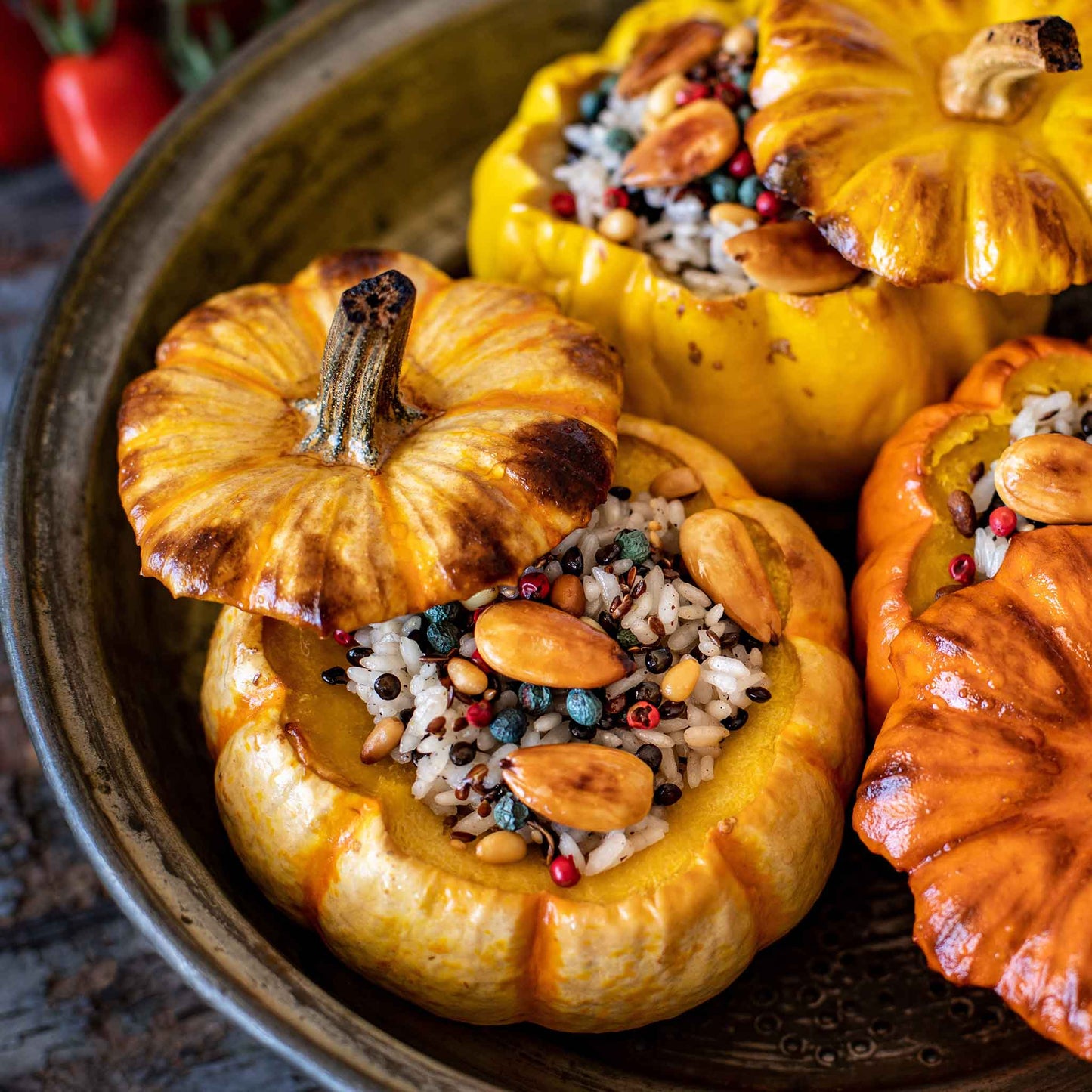 A plate of roasted Jack Be Little Pumpkins with seeds.