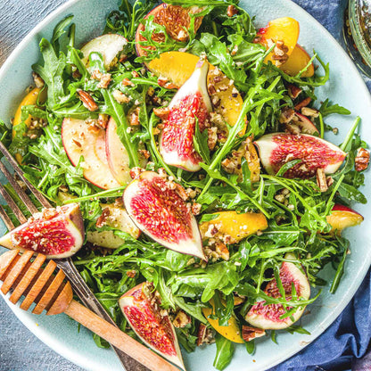 A bowl of salad using arugula wild rocket leaves.