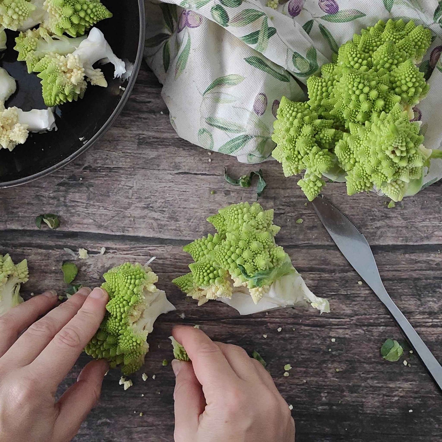 A close-up shot of the distinctive green, spiraled florets of Romanesco broccoli.
