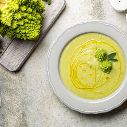 A bowl of broccoli soup made with romanesco broccoli.