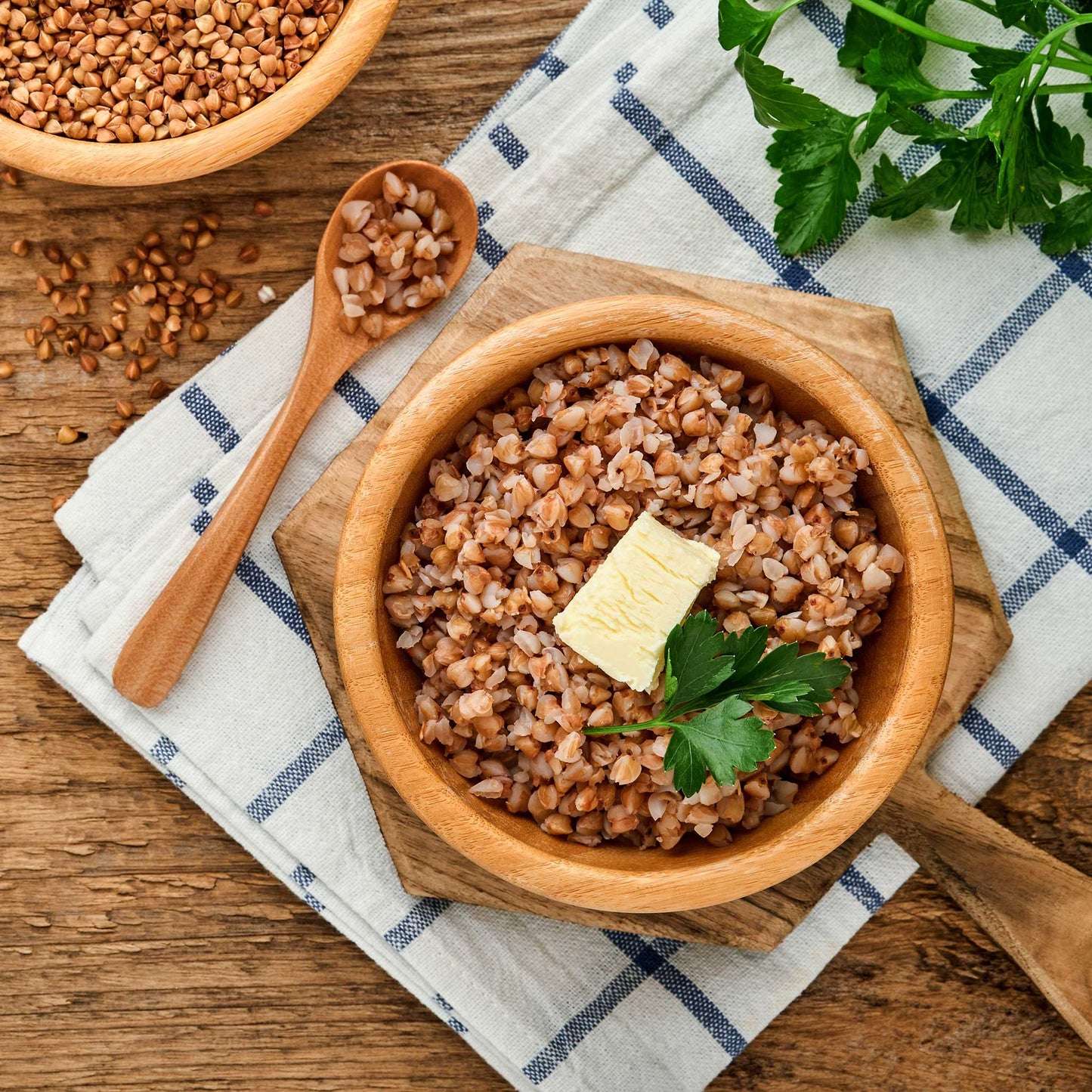 A close-up of light brown buckwheat seeds with a blurred background.