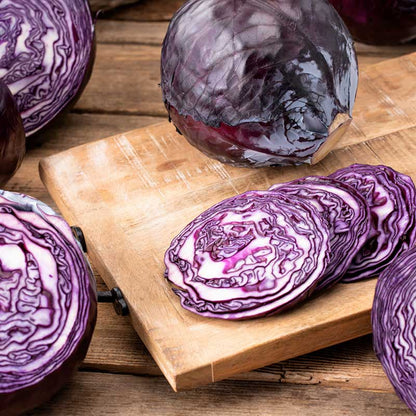 Red Acre cabbage sliced showcasing its vibrant red and white coloring. | copyright: Floramedia UK Ltd
