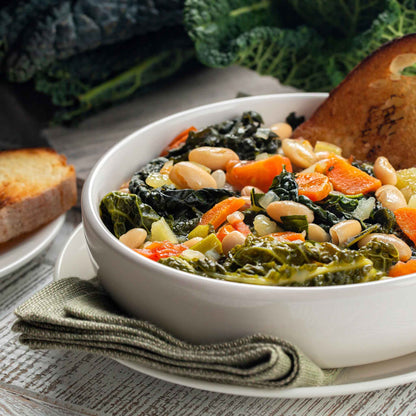 A bowl of vegetable soup with Lacinato Kale mixed in.