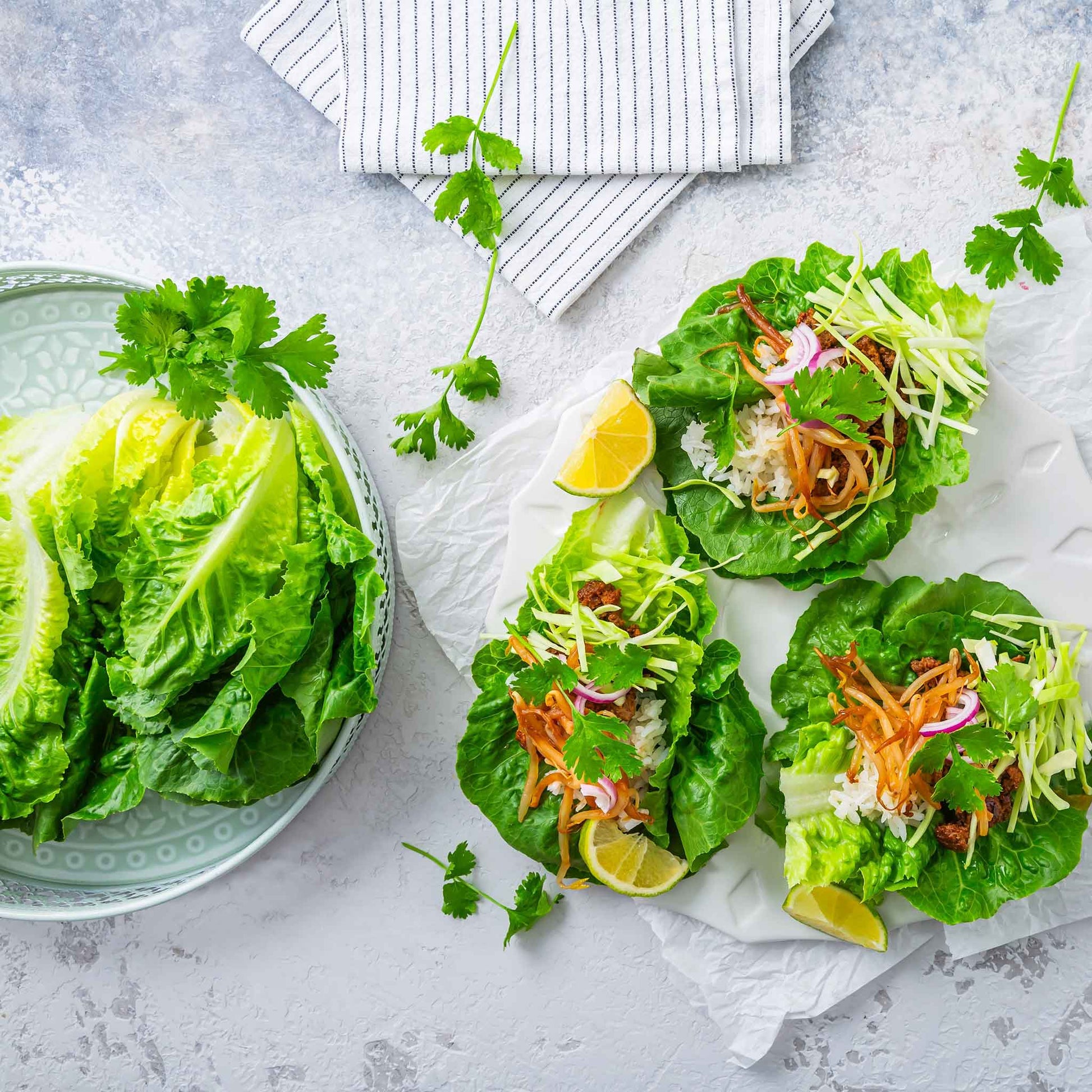 A plate of little gem lettuce next to salads made using little gem lettuce.