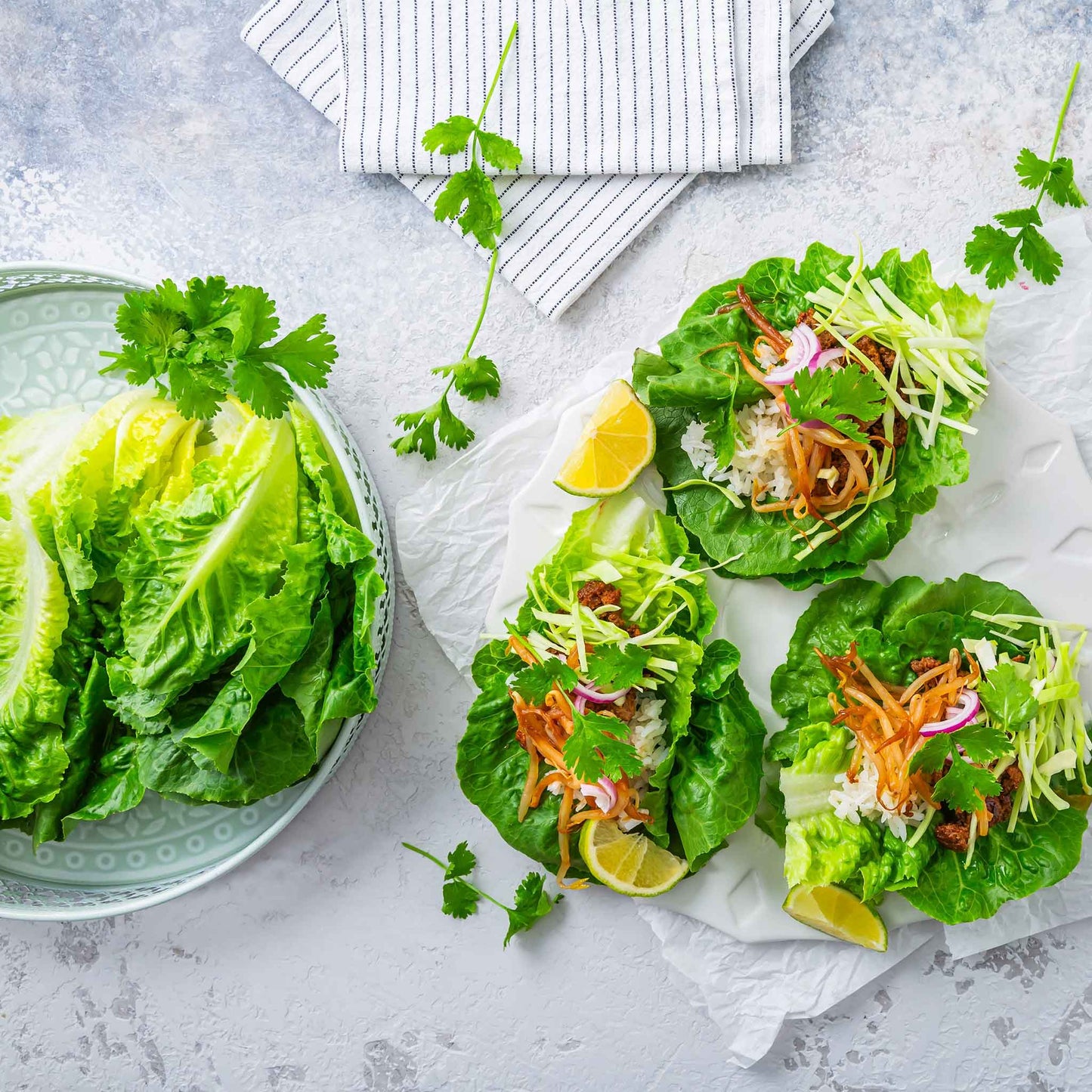 A plate of little gem lettuce next to salads made using little gem lettuce.
