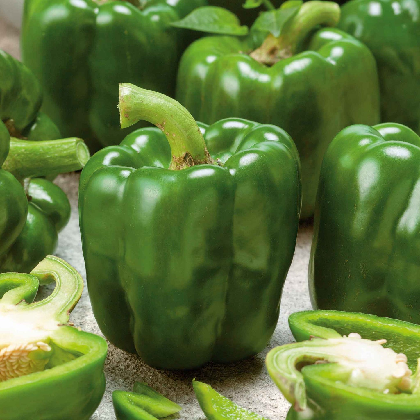 A vibrant green bell pepper, of the Emerald Giant variety, freshly picked.