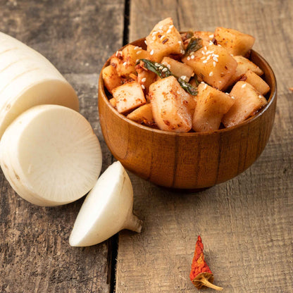 Japanese Minowase Daikon sliced radish next to cooked squash.