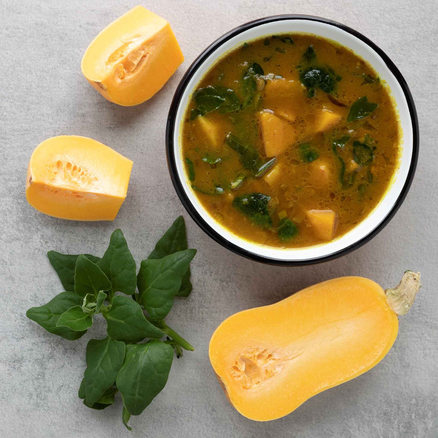 A bowl of squash and New Zealand spinach soup.